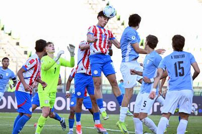 Paraguay's forward #19 David Fernandez heads the ball during the 2025 South American U-20 football championship final round match between Paraguay and Uruguay at the UCV Olympic stadium in Caracas on February 13, 2025. (Photo by Juan BARRETO / AFP)