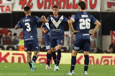 Velez Sarsfield's forward #09 Brian Romero (C) celebrates with teammates after scoring during the Argentine Professional Football League Tournament 2024 'Cesar Luis Menotti' match between River Plate and Velez Sarfield at Mas Monumental stadium in Buenos Aires on October 18, 2024. (Photo by ALEJANDRO PAGNI / AFP)