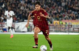 Roma's Argentinian forward #21 Paulo Dybala drives the ball during the Italian Serie A football match between AS Roma and Torino at the Olympic stadium in Rome on October 31, 2024. (Photo by Alberto PIZZOLI / AFP)
