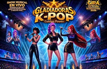 Tres artistas de K-Pop en el escenario, vestidas con trajes coloridos, actuando mientras el público las observa emocionado.
