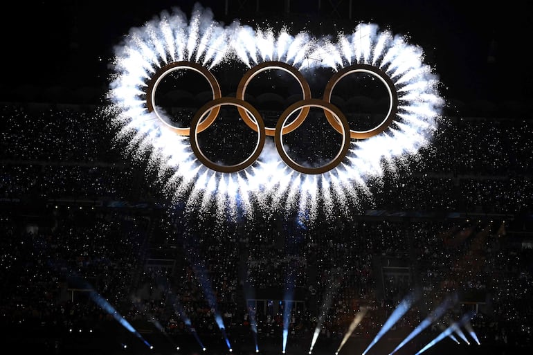 The Olympic Rings is revealed aduring the opening ceremony of the Milano Cortina 2026 Winter Olympic Games at the San Siro stadium in Milan, northern Italy, on February 6, 2026. (Photo by Gabriel BOUYS / AFP)