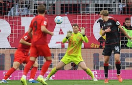 Bayern Munich's German goalkeeper #01 Manuel Neuer makes a save during the German first division Bundesliga football match FC Bayern Munich vs 1 FC Union Berlin in Munich, southern Germany, on November 2, 2024. (Photo by Alexandra BEIER / AFP) / DFL REGULATIONS PROHIBIT ANY USE OF PHOTOGRAPHS AS IMAGE SEQUENCES AND/OR QUASI-VIDEO