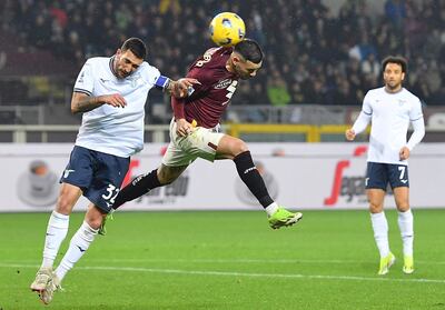 Turin (Italy), 22/02/2024.- Torino's Antonio Sanabria and Lazio's Danilo Cataldi (L) in action during the Italian Serie A soccer match Torino FC vs SS Lazio at the Olimpico Grande Torino Stadium in Turin, Italy, 22 February 2024. (Italia) EFE/EPA/ALESSANDRO DI MARCO