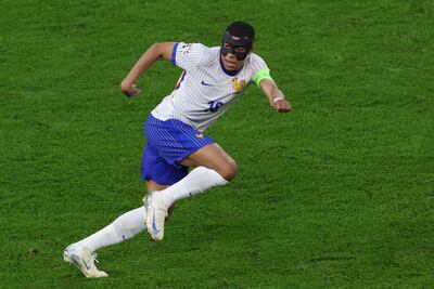 France's forward #10 Kylian Mbappe runs during the UEFA Euro 2024 quarter-final football match between Portugal and France at the Volksparkstadion in Hamburg on July 5, 2024. (Photo by Ronny HARTMANN / AFP)