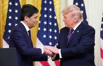 (FILES) US President Donald Trump shakes hands with the new Chairman of the Federal Reserve Kevin Warsh (L) during a swearing in ceremony in the East Room of the White House in Washington, DC on May 22, 2026. US Federal Reserve chief Kevin Warsh will chair his first meeting of the central bank's rate-setting committee next week caught between a rock and a hard place, with inflation at a three-year high and unrelenting pressure from the White House to lower rates. The Fed's 12-member open market committee (FOMC) will begin a two-day meeting on June 16, 2026, and is widely expected to hold rates steady as the effects of US President Donald Trump's war on Iran course through the world's largest economy. (Photo by Aaron Schwartz / AFP)