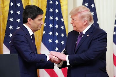 (FILES) US President Donald Trump shakes hands with the new Chairman of the Federal Reserve Kevin Warsh (L) during a swearing in ceremony in the East Room of the White House in Washington, DC on May 22, 2026. US Federal Reserve chief Kevin Warsh will chair his first meeting of the central bank's rate-setting committee next week caught between a rock and a hard place, with inflation at a three-year high and unrelenting pressure from the White House to lower rates. The Fed's 12-member open market committee (FOMC) will begin a two-day meeting on June 16, 2026, and is widely expected to hold rates steady as the effects of US President Donald Trump's war on Iran course through the world's largest economy. (Photo by Aaron Schwartz / AFP)