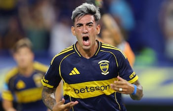 Boca Juniors' defender #02 Lautaro Di Lollo celebrates scoring the opening goal during the Argentine Professional Football League 2026 Apertura Tournament match between Boca Juniors and Deportivo Riestra at La Bombonera Stadium in Buenos Aires on January 25, 2026. (Photo by ALEJANDRO PAGNI / AFP)