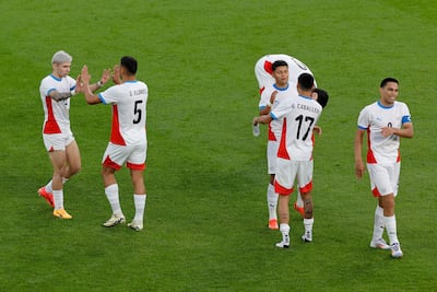 Paraguay's players celebrate at the end of in the men's group D football match between Israel and Paraguay during the Paris 2024 Olympic Games at the Parc des Princes in Paris on July 27, 2024. (Photo by GEOFFROY VAN DER HASSELT / AFP)