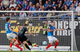 Bayern Munich's English forward #09 Harry Kane scores the 0-4 goal during the German first division Bundesliga football match between Holstein Kiel and FC Bayern Munich in Kiel, northern Germany, on September 14, 2024. (Photo by AXEL HEIMKEN / AFP) / DFL REGULATIONS PROHIBIT ANY USE OF PHOTOGRAPHS AS IMAGE SEQUENCES AND/OR QUASI-VIDEO