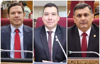 Diego Candia y Edgar Olmedo en trajes formales, con corbatas rojas, en ambiente sobrio de salón de sesiones.