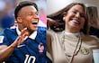 Kylian Mbappé sonriente en camiseta azul con número 10 junto a Celeste Amarilla, también sonriente con suéter claro y joyería. Ambiente festivo.