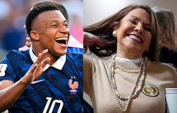 Kylian Mbappé sonriente en camiseta azul con número 10 junto a Celeste Amarilla, también sonriente con suéter claro y joyería. Ambiente festivo.