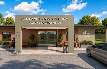 Perro sentado junto a una mujer en un banco, edificio de clínica veterinaria pública de fondo con señalización clara.
