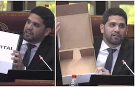Raúl Benítez con traje negro y corbata, sostiene una caja etiquetada 'HOSPITAL', discutiendo en un ambiente de deliberación política.