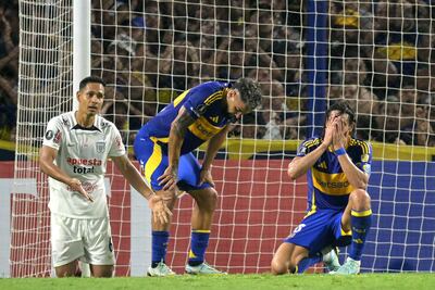 Boca Juniors' Uruguayan forward #10 Edinson Cavani (R) reacts after missing a scoring goal during the Copa Libertadores qualification second round second leg football match between Argentina's Boca Juniors and Peru's Alianza Lima at the Alberto J. Armando "La Bombonera" stadium in Buenos Aires on February 25, 2025. (Photo by JUAN MABROMATA / AFP)