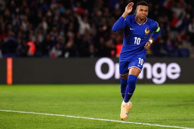 France's forward #10 Kylian Mbappe celebrates after shooting a penalty kick to score his team first goal during the 2026 World Cup qualifiers Europe zone group D football match between France and Ukraine at the Parc des Princes stadium in Paris, on November 13, 2025. (Photo by FRANCK FIFE / AFP)