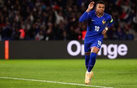 France's forward #10 Kylian Mbappe celebrates after shooting a penalty kick to score his team first goal during the 2026 World Cup qualifiers Europe zone group D football match between France and Ukraine at the Parc des Princes stadium in Paris, on November 13, 2025. (Photo by FRANCK FIFE / AFP)