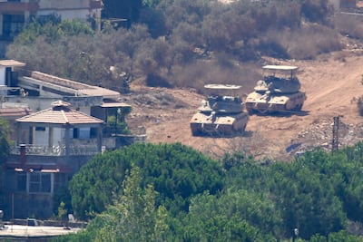 Zawtar al Gharbiyah (Lebanon), 05/08/2026.- Israeli tanks in Zawtar al Sharqiyah as seen from Zawtar al Gharbiya, southern Lebanon, 05 August 2026. Zawtar al-Gharbiya is among the designated pilot zones under the ceasefire agreement between Lebanon and Israel, from which Israeli forces have withdrawn. (Líbano) EFE/EPA/STRINGER
