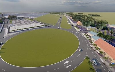 Diseño urbano de rotonda con pavimento y edificios alrededor, en área en desarrollo sin personas visibles.