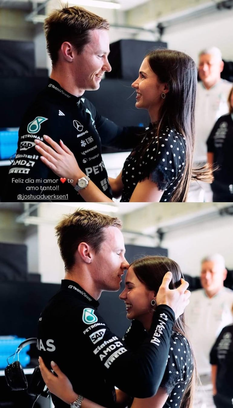 Joshua Duerksen en overol negro y Anneke Rahn en blusa negra con puntos, sonriendo en un garaje de automovilismo.