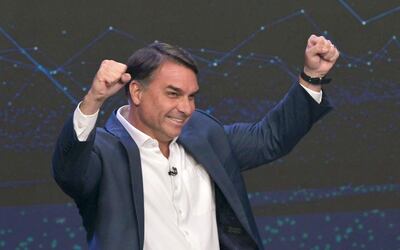 Brazil's right-wing presidential candidate Flavio Bolsonaro gestures during a debate ahead of the presidential election runoff in Sao Paulo, Brazil, on October 18, 2026. (Photo by NELSON ALMEIDA / AFP)