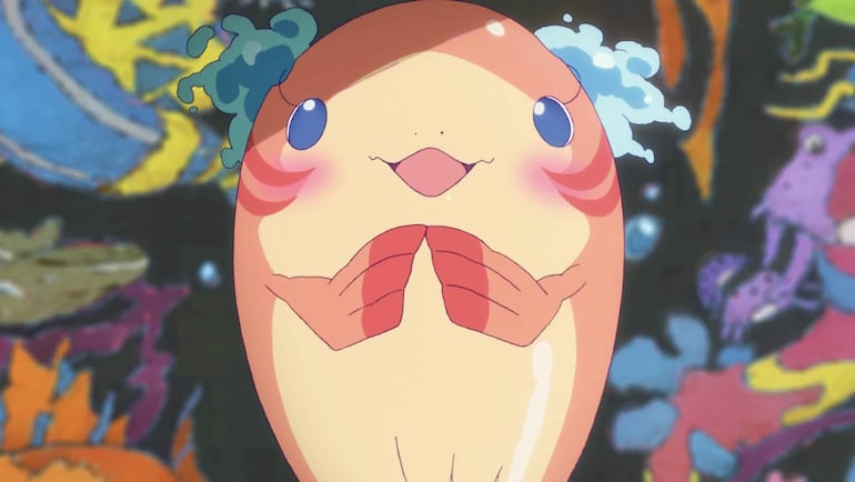 Cartel de la película 'ChaO' exhibido en evento, rodeado de un ambiente festivo con colores vibrantes.