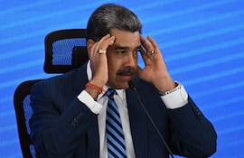 (FILES) Venezuela's President Nicolas Maduro gestures during the Meeting of Jurists in Defense of International Law at the Eurobuilding Hotel in Caracas on November 14, 2025. In an interview on January 1, 2026, Venezuelan President Nicolás Maduro avoided confirming or denying an alleged attack on a narcotics facility that, according to Donald Trump, the United States recently carried out on Venezuelan territory. (Photo by Federico PARRA / AFP)
