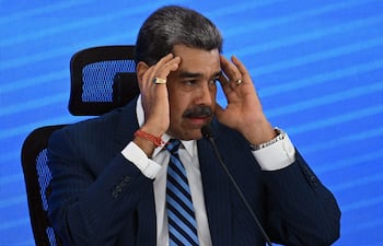 (FILES) Venezuela's President Nicolas Maduro gestures during the Meeting of Jurists in Defense of International Law at the Eurobuilding Hotel in Caracas on November 14, 2025. In an interview on January 1, 2026, Venezuelan President Nicolás Maduro avoided confirming or denying an alleged attack on a narcotics facility that, according to Donald Trump, the United States recently carried out on Venezuelan territory. (Photo by Federico PARRA / AFP)