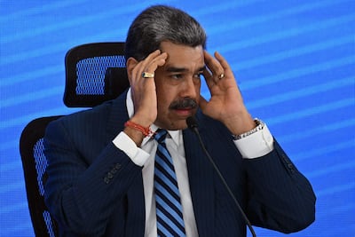 (FILES) Venezuela's President Nicolas Maduro gestures during the Meeting of Jurists in Defense of International Law at the Eurobuilding Hotel in Caracas on November 14, 2025. In an interview on January 1, 2026, Venezuelan President Nicolás Maduro avoided confirming or denying an alleged attack on a narcotics facility that, according to Donald Trump, the United States recently carried out on Venezuelan territory. (Photo by Federico PARRA / AFP)