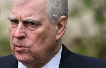 (FILES) Britain's Prince Andrew, Duke of York reacts as he leaves St. George's Chapel, in Windsor Castle, after attending the Easter Mattins Service, on March 31, 2024. King Charles will strip his younger brother Andrew of his royal titles and long-term residence on the Windsor estate, the palace said on October 30, 2025, the latest fallout to hit the scandal-plagued royal over the Jeffrey Epstein affair. "Prince Andrew will now be known as Andrew Mountbatten Windsor," the palace said, adding that Charles had begun the formal process to strip the titles from his brother. (Photo by JUSTIN TALLIS / AFP)