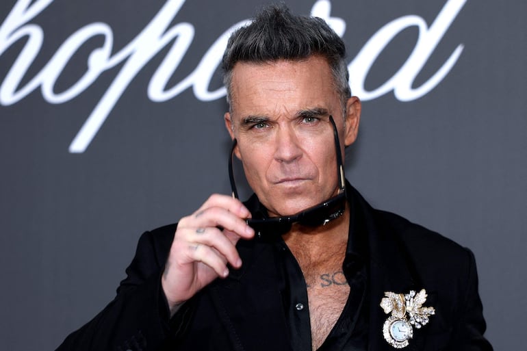 El cantautor británico Robbie Williams estuvo presente en la gala anual de la Fundación Estadounidense para la Investigación del SIDA (amfAR) en Cannes. (Thibaud MORITZ / AFP)