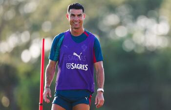 PALM BEACH GARDENS, FLORIDA - JUNE 13: Cristiano Ronaldo #7 of Portugal smiles during a training session ahead of the FIFA World Cup 2026 on June 13, 2026 in Palm Beach Gardens, Florida. Megan Briggs/Getty Images/AFP (Photo by Megan Briggs / GETTY IMAGES NORTH AMERICA / Getty Images via AFP)