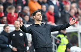 (FILES) Bayer Leverkusen's Spanish head coach Xabi Alonso reacts after the end of the German first division Bundesliga football match SC Freiburg v Bayer 04 Leverkusen in Freiburg, southwestern Germany on March 17, 2024. Xabi Alonso, who was seen by many as Liverpool's top target to replace Jurgen Klopp as their manager, said on March 29, 2024 he is staying at Bundesliga leaders Bayer Leverkusen next season. (Photo by THOMAS KIENZLE / AFP) / DFL REGULATIONS PROHIBIT ANY USE OF PHOTOGRAPHS AS IMAGE SEQUENCES AND/OR QUASI-VIDEO