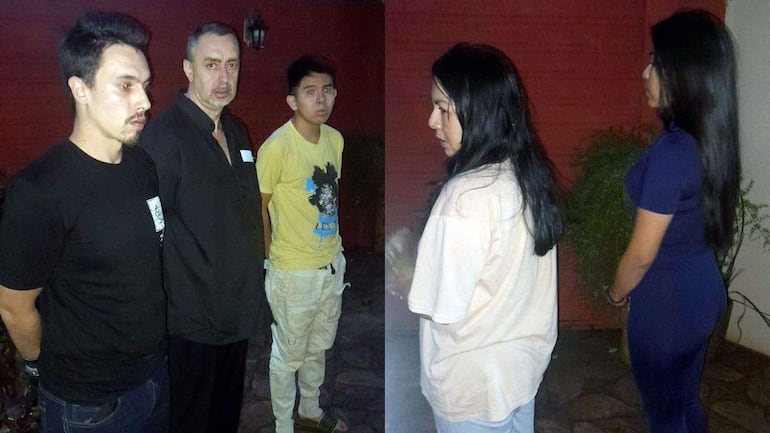 Aitor y Fernando Barrionuevo en camiseta negra junto a Luis Andrés Uriarte, mientras Scheila Magno y Beihit Gutiérrez conversan vestidas con ropa ligera, en un entorno nocturno.