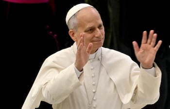 Pope Leo XIV waves during his weekly general audience inside Paul VI hall at the Vatican on January 28, 2026. (Photo by Filippo MONTEFORTE / AFP)