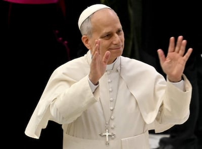 Pope Leo XIV waves during his weekly general audience inside Paul VI hall at the Vatican on January 28, 2026. (Photo by Filippo MONTEFORTE / AFP)
