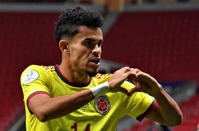 (FILES) Colombia's Luis Diaz celebrates after scoring against Argentina during their Conmebol 2021 Copa America football tournament semi-final match at the Mane Garrincha Stadium in Brasilia, Brazil, on July 6, 2021. The South American inexhaustible youth craddle is starting to replace its pool of players, many of which have just won the Champions League, the Premier League or are competing at the highest level. The list includes Vinicius Jr, Rodrygo, Julián Álvarez, Mac Allister, Luis Díaz, and Federico Valverde, among others. (Photo by NELSON ALMEIDA / AFP)