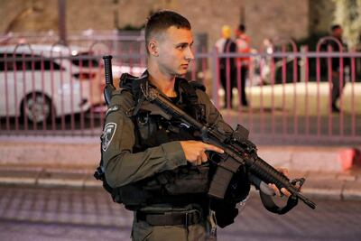 An Israeli border guard stand guards at the scene of a stabbing attack at the Damascus Gate of the Old City of Jerusalem on May 8, 2022. (Photo by Ahmad GHARABLI / AFP)