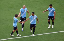 Jugadores del City celebran el triunfo ante Juventus en fase de Grupos.