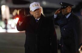 US President Donald Trump steps off Air Force One upon arrival at Joint Base Andrews in Maryland on February 1, 2026, as he returns from Palm Beach, Florida. (Photo by SAUL LOEB / AFP)