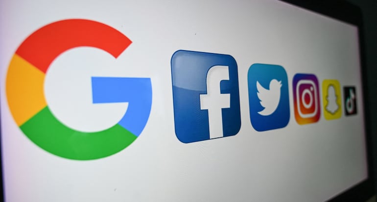 (FILES) In this file photo taken on October 21, 2020 shows the logo of the multinational American Internet technology and services company, from left : Google, the American online social media and social networking service, Facebook, Twitter, Instragram, Snapchat, and Tik Tok on a computer screen in Lille. - Americans who rely on social media as their main source of news are more likely believe false or unproven stories about important topics such as politics and Covid-19, a survey showed on February 22, 2021. (Photo by DENIS CHARLET / AFP)