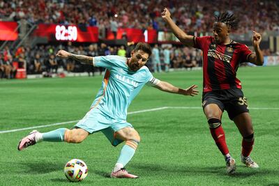 ATLANTA, GEORGIA - NOVEMBER 02: Lionel Messi #10 of Inter Miami attempts to cross the ball against Ajani Fortune #35 of Atlanta United during the second half of the 2024 MLS Cup Playoffs at Mercedes-Benz Stadium on November 02, 2024 in Atlanta, Georgia. Kevin C. Cox/Getty Images/AFP (Photo by Kevin C. Cox / GETTY IMAGES NORTH AMERICA / Getty Images via AFP)