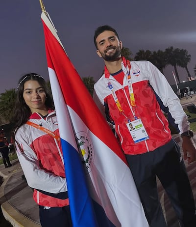 Fiorella Goritzia Gatti (18 años) y Francesco Marcantonio (27), de squash, en la ceremonia inaugural.