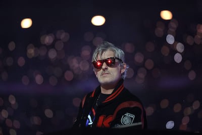 (FILES) French DJ Kavinsky performs on stage during the Paris 2024 Paralympic Games Closing Ceremony at the Stade de France, in Saint-Denis, in the outskirts of Paris, on September 8, 2024. French DJ Kavinsky was found dead at his place in Paris announced Paris' prosecutor's office (Photo by Thibaud Moritz / AFP)