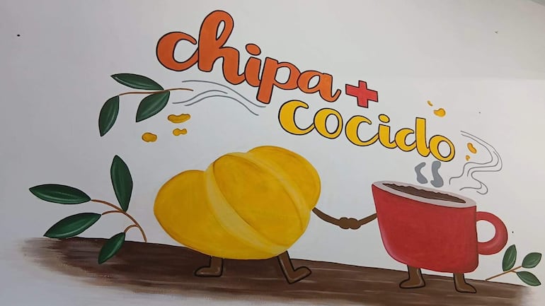 Mural decorativo con el texto 'chipa cocido' y una taza, representando la cultura gastronómica paraguaya.