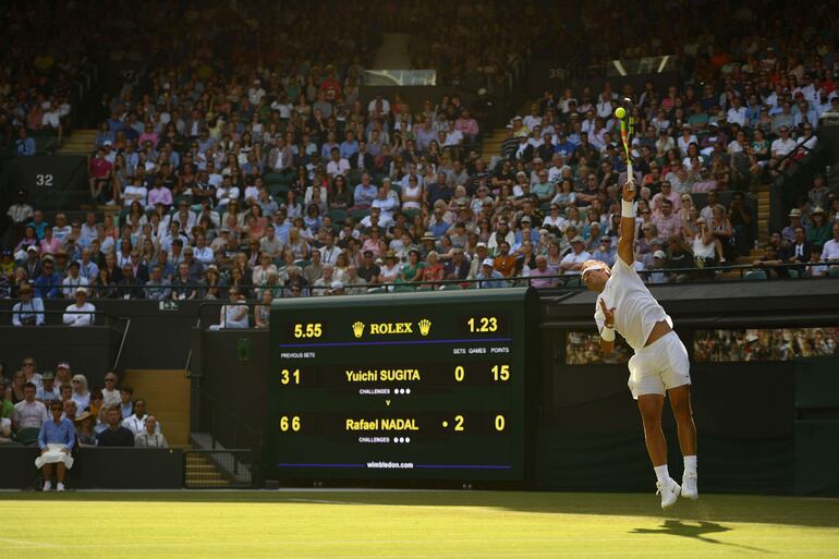 Spain's Rafael Nadal serves against Japan's Yuichi Sugita during their men's singles first round match on the second day of the 2019 Wimbledon Championships at The All England Lawn Tennis Club in Wimbledon, southwest London, on July 2, 2019. (Photo by Daniel LEAL-OLIVAS / AFP) / RESTRICTED TO EDITORIAL USE