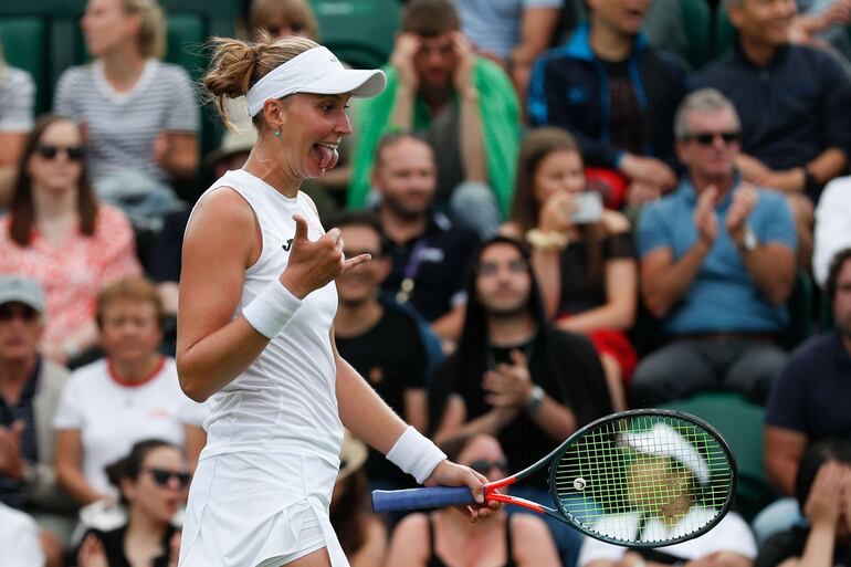 Brazil's Beatriz Haddad Maia celebrates beating Spain's Garbine Muguruza during their women's singles first round match on the second day of the 2019 Wimbledon Championships at The All England Lawn Tennis Club in Wimbledon, southwest London, on July 2, 2019. (Photo by Adrian DENNIS / AFP) / RESTRICTED TO EDITORIAL USE