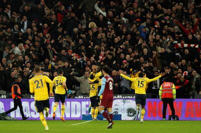 Arsenal's Gabonese striker Pierre-Emerick Aubameyang (C) celebrates scoring his team's third goal with Arsenal's French-born Ivorian midfielder Nicolas Pepe and Arsenal's Brazilian striker Gabriel Martinelli during the English Premier League football match between West Ham United and Arsenal at The London Stadium, in east London on December 9, 2019. (Photo by Adrian DENNIS / AFP) / RESTRICTED TO EDITORIAL USE. No use with unauthorized audio, video, data, fixture lists, club/league logos or 'live' services. Online in-match use limited to 120 images. An additional 40 images may be used in extra time. No video emulation. Social media in-match use limited to 120 images. An additional 40 images may be used in extra time. No use in betting publications, games or single club/league/player publications. / 