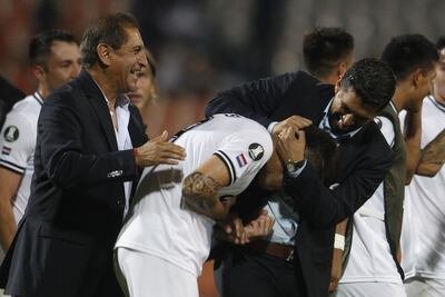Ramón y su hijo Emiliano celebrando con Nicolás Milesi.