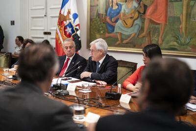 Santiago (Chile), 16/03/2020.- A handout photo made available by the Presidency of Chile that shows Chilean President Sebastian Pinera (C) during a ministerial meeting at the Moneda Palace in Santiago, Chile, 16 March 2020. Pinera informed that he will close borders to avoid the spread of the coronavirus in the country, where 155 cases of COVID-19 have been confirmed. EFE/EPA/PRESIDENCY OF CHILE / HANDOUT HANDOUT EDITORIAL USE ONLY/NO SALES
